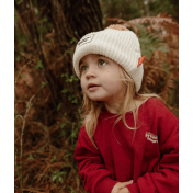 bébé avec bonnet ponpon Bloxk Sandy