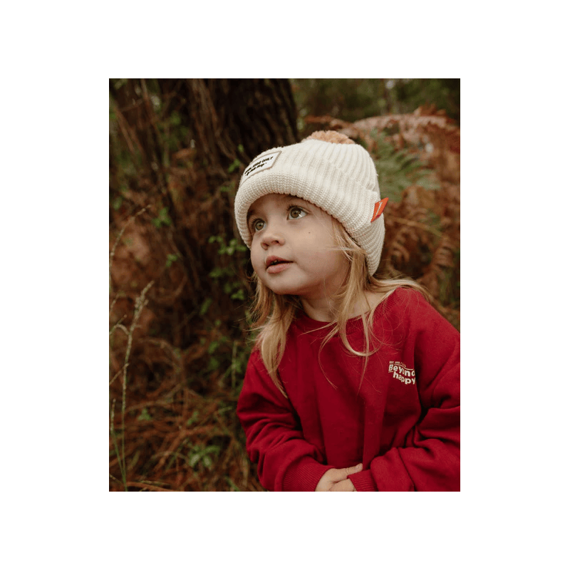 bébé avec bonnet ponpon Bloxk Sandy